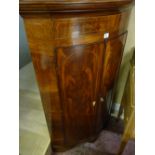 AN EXCELLENT LATE GEORGIAN INLAID MAHOGANY STANDING CORNER CUPBOARD, bow fronted with polished top
