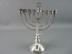 A SILVER JEWISH MENORAH, 24 cms high on a rose decorated circular base, 6.4 troy ozs with 800 mark