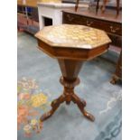 A VICTORIAN INLAID WALNUT WORK TABLE, the octagonal top with extensive various inlays, opening to