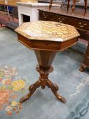 A VICTORIAN INLAID WALNUT WORK TABLE, the octagonal top with extensive various inlays, opening to