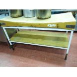 *A WOODEN BUTCHER'S BLOCK, 150 x 60 cms set on a metallic table with wooden base shelf