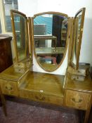 AN EDWARDIAN INLAID TRIPLE MIRROR DRESSING TABLE having a shield shaped central mirror, shaped top