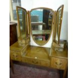 AN EDWARDIAN INLAID TRIPLE MIRROR DRESSING TABLE having a shield shaped central mirror, shaped top