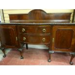 A MAHOGANY BOW FRONT SIDEBOARD with arched railback over a carved edge top, twin central bowed