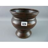 A 19th CENTURY BEATEN COPPER PLANTER, urn shaped with foldover rim, hammered finish with bronzed