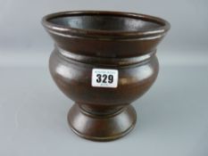 A 19th CENTURY BEATEN COPPER PLANTER, urn shaped with foldover rim, hammered finish with bronzed