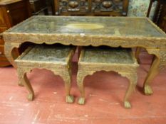 A GOOD SET OF THREE INDIAN CARVED HARDWOOD TABLES, the tops with central oval panels surrounded by