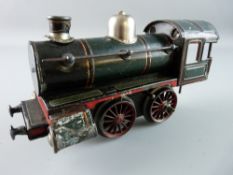 A GAUGE 0 CLOCKWORK LOCOMOTIVE in green, black and red livery, no visible maker's marks, 21 cms long
