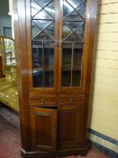 A 19th CENTURY WELSH OAK STANDING CORNER CUPBOARD, one piece with shaped cornice over twin ten panel