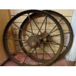 A PAIR OF VICTORIAN CAST IRON FARMING IMPLEMENT WHEELS with iron spokes, 74 cms diameter