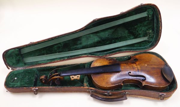 A VIOLIN IN A 'CROCODILE' LEATHER CASE the violin bearing internal label for Nicolaus Amatus (