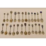 A COLLECTION OF TWENTY-FOUR SILVER SOUVENIR SPOONS for British and Irish resorts, all but three with