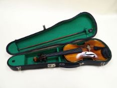 A BOOSEY & HAWKES 'GOLDEN STRAD' VIOLIN with case and bow