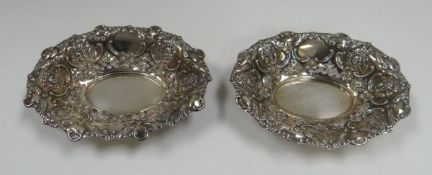 A PAIR OF SILVER BASKETS of oval form and decorated in the high-Victorian style with openwork and