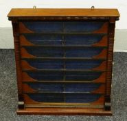 A TOBACCONISTS CIGAR CABINET with glass frontage and seven pull-out semi glazed side-drawers