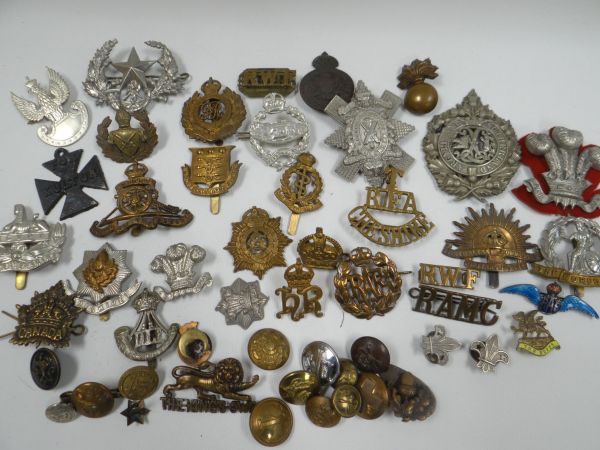 APPROXIMATELY 35 MILITARY CAP-BADGES for various regiments and including an enameled RAF silver