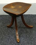 AN INTERESTING FARM STOOL on three curved supports and with half moon basin seat