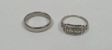 TWO PLATINUM RINGS one with two centre diamonds to the centre and diamonds to the shoulders, 3.52gms