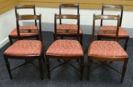 SET OF SIX DINING CHAIRS in mahogany with rail backs, reeded supports and cross stretcher