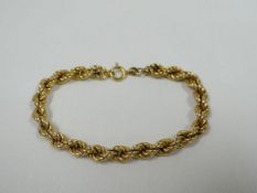 A 9CT YELLOW GOLD ROPE-TWIST BRACELET, 8.1gms