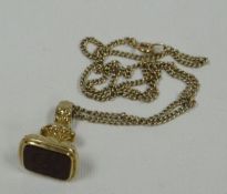 A CURB CHAIN & SEAL FOB in 9ct gold, 18.3gms gross