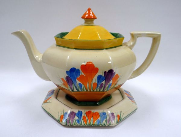 A CLARICE CLIFF 'CROCUS' TEAPOT & STAND for the Bizarre range and of octagonal form