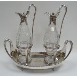 A GEORGE III SILVER CRUET SET by important makers John Wakelin & William Taylor, the two cut-glass
