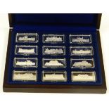 A CASED SET OF TWELVE SILVER INGOTS commemorating British castles, 12.2ozs total approx