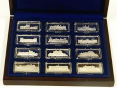 A CASED SET OF TWELVE SILVER INGOTS commemorating British castles, 12.2ozs total approx