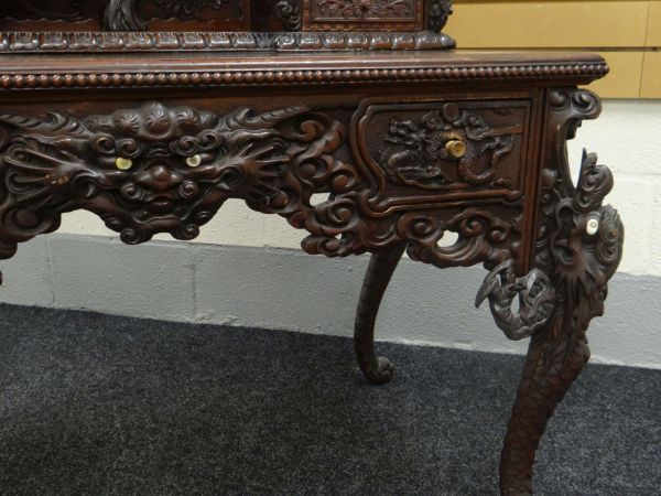 A JAPANESE MEIJI CARVED DESK with cabinet and recess top and base of two drawers, heavily carved - Image 5 of 6