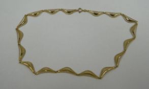 A 9CT YELLOW GOLD NECKLACE with shaped and textured links, 11.3gms