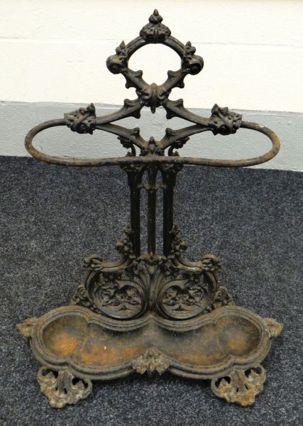 A VICTORIAN CAST IRON UMBRELLA STAND of fancy filigree form