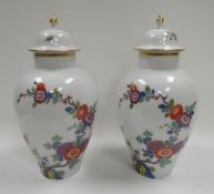 A PAIR OF MODERN MEISSEN PORCELAIN VASES with covers, of baluster form and decorated with Oriental