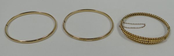 THREE 9CT YELLOW GOLD BANGLES 16gms total