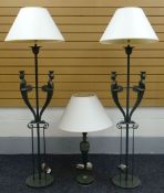 A PAIR OF MODERN FIGURAL STANDARD LAMPS green painted on circular bases and with a matching table