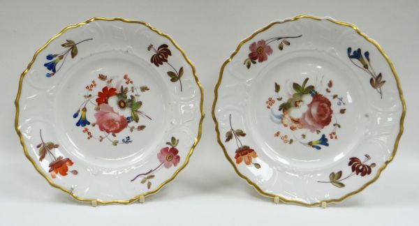 A PAIR OF PORCELAIN PLATES having moulded borders and with sprays of flowers, each with red - Image 2 of 3