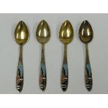 A SET OF FOUR RUSSIAN ART DECO SILVER GILT & ENAMEL TEA SPOONS the terminals enamelled with stylised