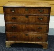 A MID NINETEENTH CENTURY CHEST OF DRAWERS having four graduated long drawers on bracket feet and