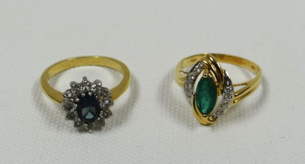 TWO RINGS comprising one modern ring marked 18k and another with outer diamonds and centre blue