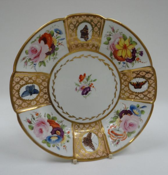 A SWANSEA PORCELAIN DISH with alternating panels of butterflies and flowers to the border and with a