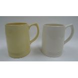 A PAIR OF KEITH MURRAY DESIGN TANKARDS FOR WEDGWOOD, 13cms high