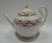 A DERBY PORCELAIN TEAPOT & STAND in white-ground, the body, stand and conical cover decorated with a