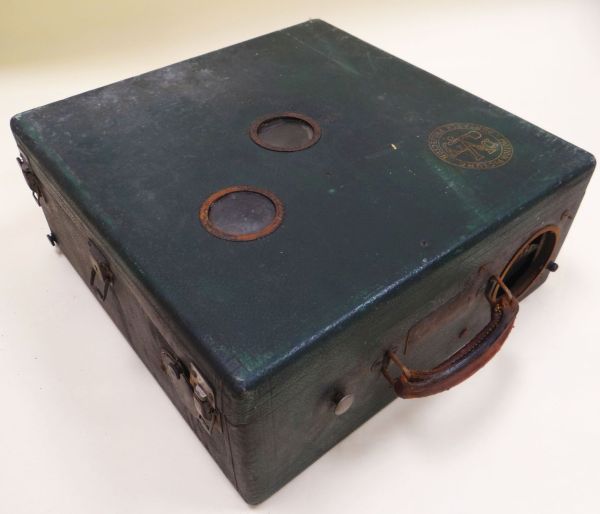 A DEVRY CHICAGO MOTION PICTURE PORTABLE PROJECTOR in a green leather effect case Provenance: from