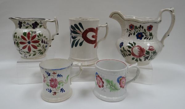 A PARCEL OF WELSH POTTERY comprising large floral jug, smaller jug and three mugs, all with