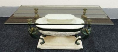 A MODERN GLASS TOP COFFEE TABLE on a figural and faux-marble base in the classical Egyptian style,