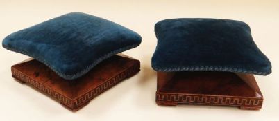 A PAIR OF VELVET FOOT CUSHIONS raised on walnut pyramidal bases with Grecian key-style decoration