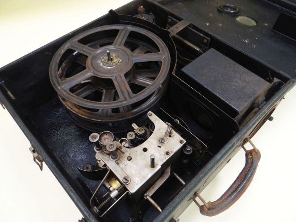 A DEVRY CHICAGO MOTION PICTURE PORTABLE PROJECTOR in a green leather effect case Provenance: from - Image 2 of 3