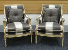 A PAIR OF REPRODUCTION FRENCH STYLE CHAIRS in a striped padded upholstery