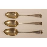 A SET OF THREE ENGLISH SILVER SERVING SPOONS with engraved deer head heraldry to the terminals,