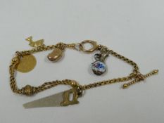 A 9CT GOLD CHARM BRACELET & CHARMS, 14gms gross